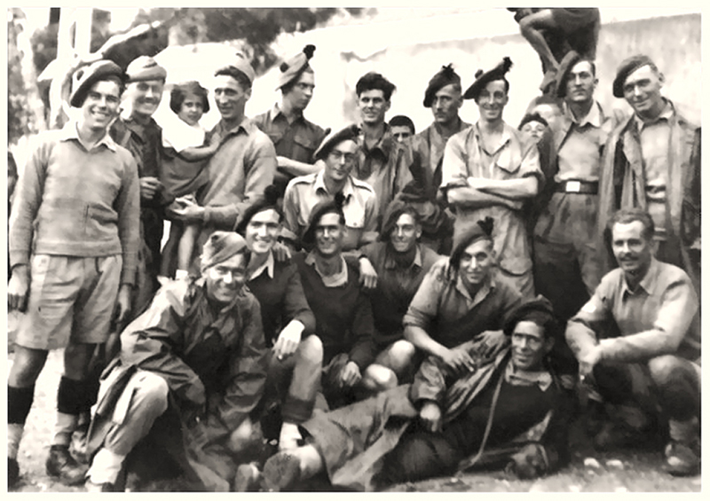 Private Ernest Arthur Lawes, is fourth from the left, front row, crouchin